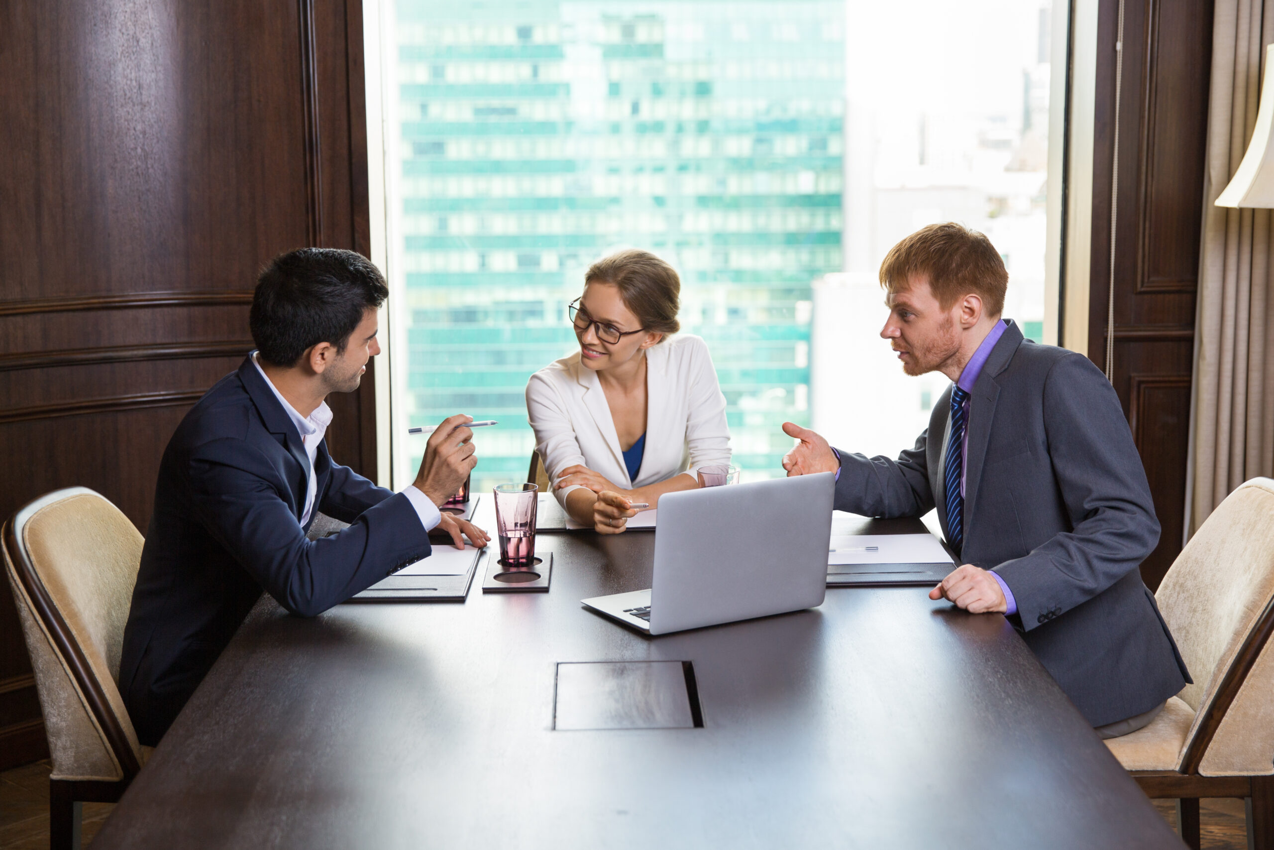 Three Business People Discussing Issues